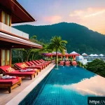 Home 19 푸켓 휴양지 비교 - A vibrant beach resort scene at Patong Beach in Phuket during sunset, featuring a modern beachfront ...